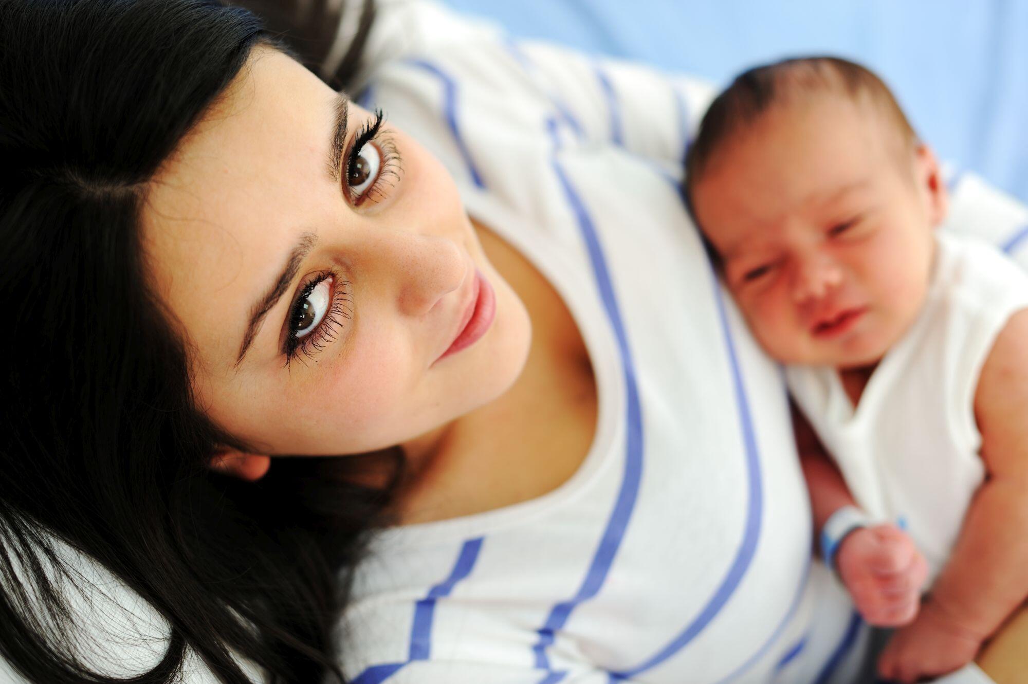 Happy mother with newborn baby