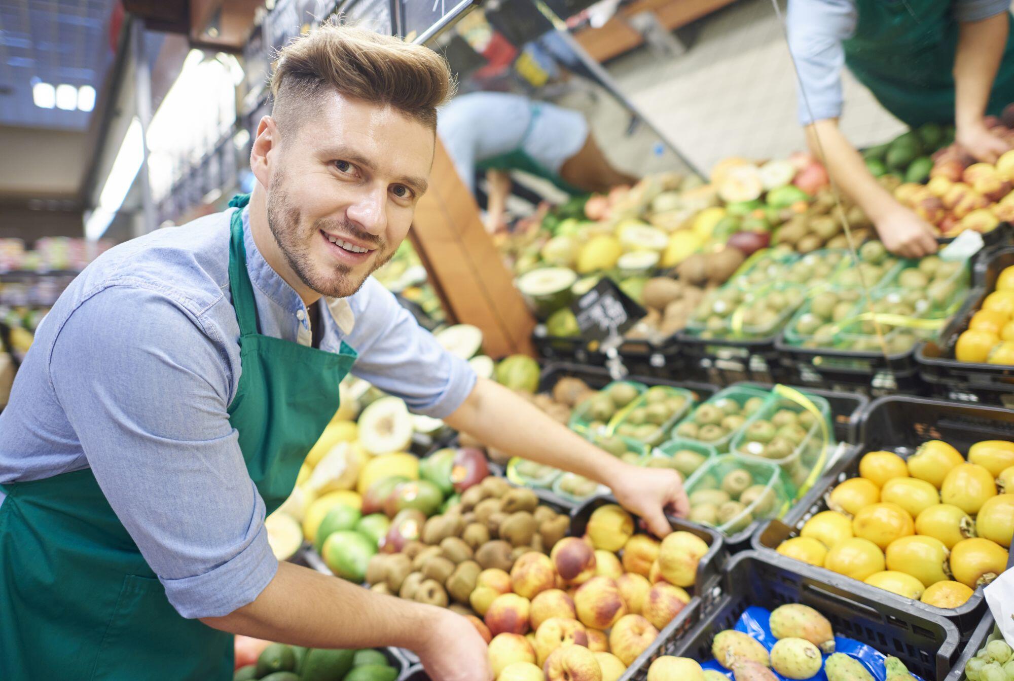 Man working hard in supermarket